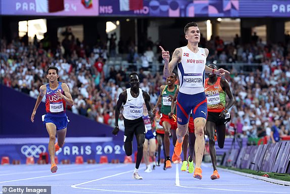 PARIS, FRANCE - AUGUST 10: Jakob Ingebrigtsen of Team Norway celebrates winning the Gold medal in Men's 5000m Final on day fifteen of the Olympic Games Paris 2024 at Stade de France on August 10, 2024 in Paris, France. (Photo by Hannah Peters/Getty Images)