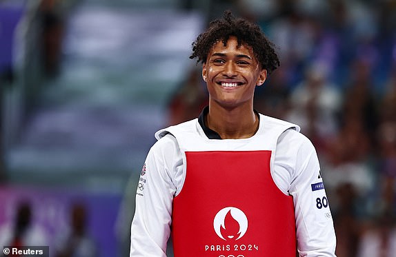 Paris 2024 Olympics - Taekwondo - Men +80kg Round of 16 - Grand Palais, Paris, France - August 10, 2024. Caden Cunningham of Britain reacts after winning his bout against Abdoul Issoufou of Niger. REUTERS/Tingshu Wang