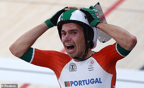 Paris 2024 Olympics - Track Cycling - Men's Madison, Final - Saint-Quentin-en-Yvelines Velodrome, Montigny-le-Bretonneux, France - August 10, 2024. Rui Oliveira of Portugal celebrates after winning gold. REUTERS/Agustin Marcarian