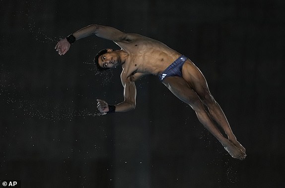 Britain's Kyle Kothari competes in the men's 10m platform diving semifinal, at the 2024 Summer Olympics, Saturday, Aug. 10, 2024, in Saint-Denis, France. (AP Photo/Lee Jin-man)