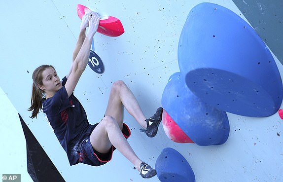 Erin McNeice of Great Britain competes in the women's boulder and lead, boulder final, during the sport climbing competition at the 2024 Summer Olympics, Saturday, Aug. 10, 2024, in Le Bourget, France. (AP Photo/Tsvangirayi Mukwazhi)