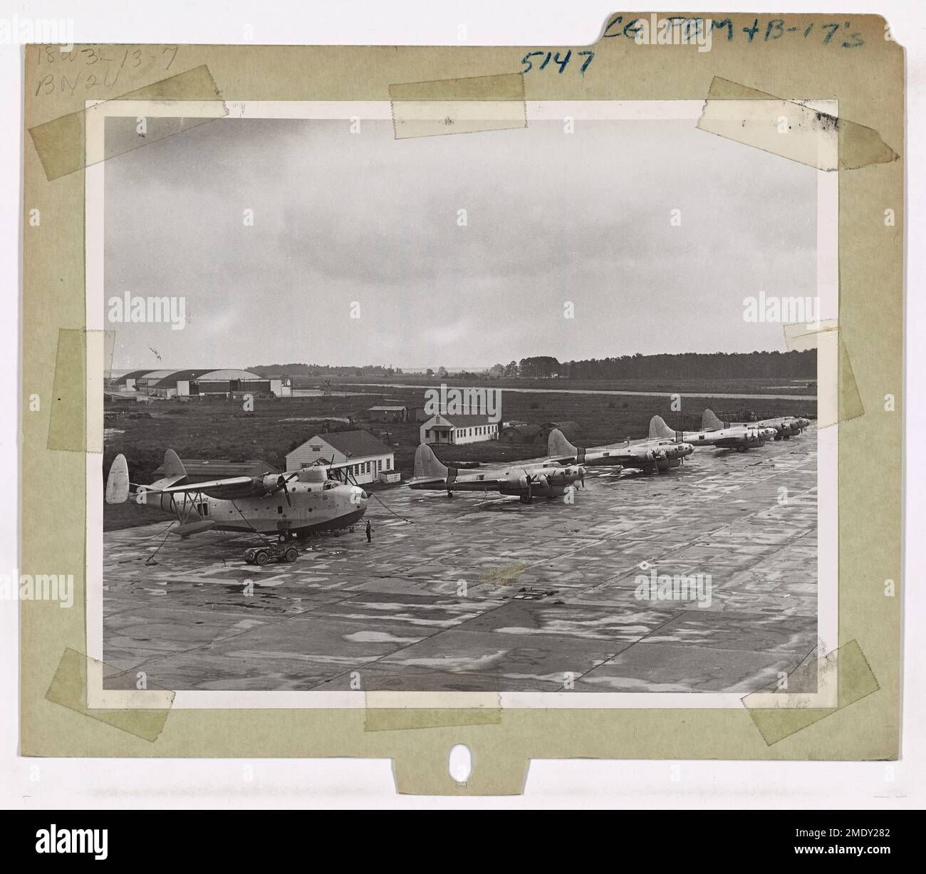 coast-guard-pbm-b-17s-scene-at-a-coast-guard-air-station-shows-left-to-right-a-coast-guard-pbm-and-four-b-17s-g