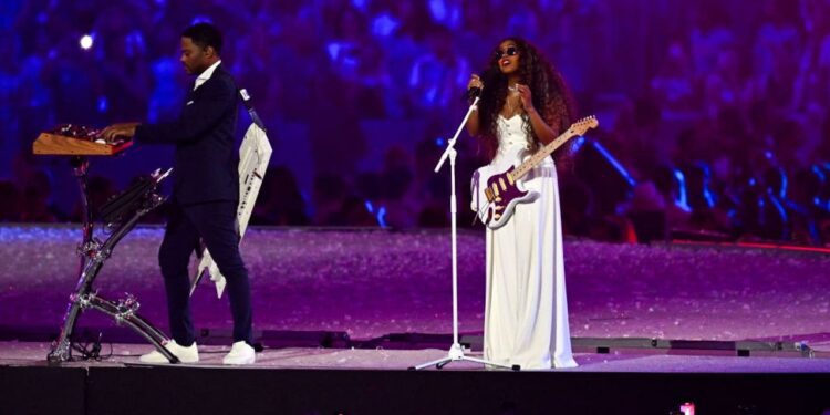 California native H.E.R. sings national anthem at Olympics closing ceremony