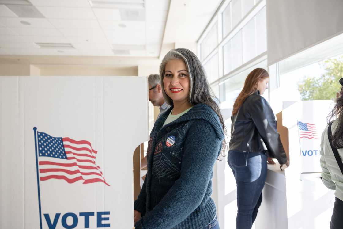 A woman casts her vote at a local community centre.