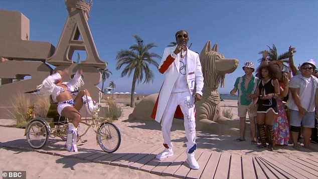 Los Angeles showed it is ready for the games with live performances from Californian natives Snoop Dogg (pictured), the Red Hot Chili Peppers, and Billie Eilish on Venice Beach