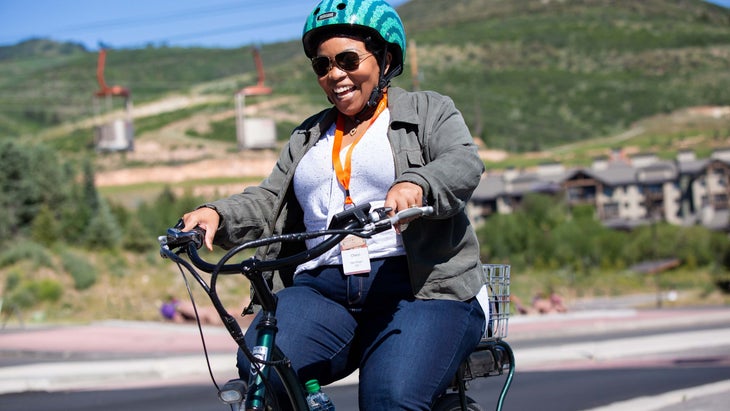 woman in Park City, Utah, smiles on an ebike