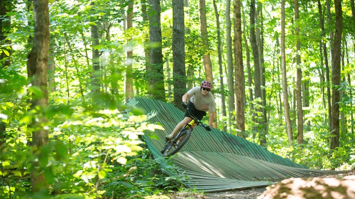 Rider in forest Highlands Bike Park, Boyne Resort