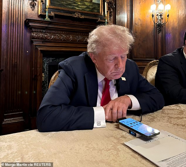 Trump is pictured on Monday night, participating in his interview with Elon Musk