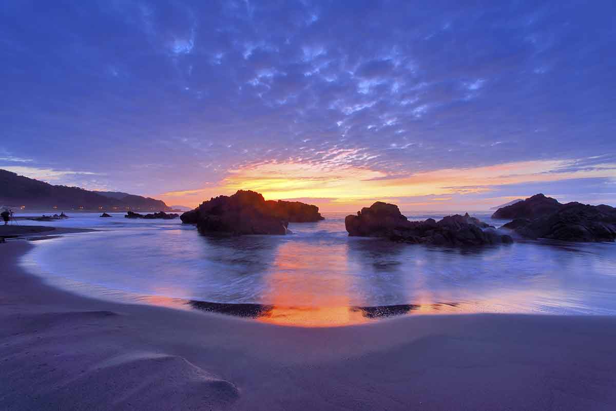 Waiao Beach Taiwan dusk over the rocks and sand