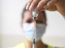 A health professional prepares a dose of a mpox vaccine at the Edison municipal vaccination centre in Paris Wednesday July 27, 2022.