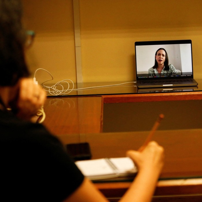 Venezuela’s opposition leader Maria Corina Machado is seen on a laptop screen during a press conference with Mexican media via Zoom