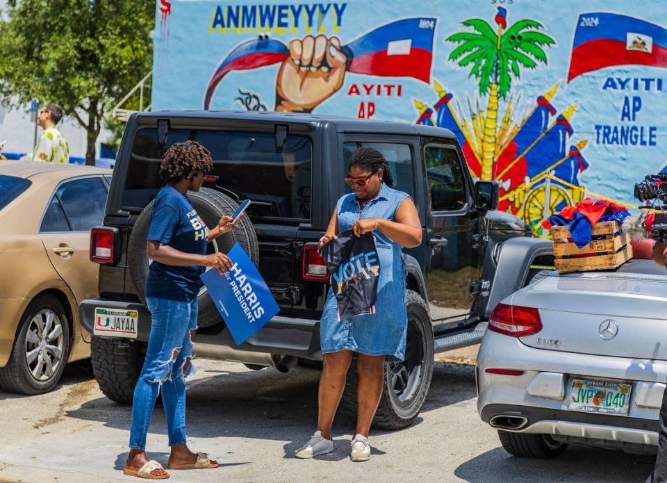 Nancy Metayer Bowen (left), Director of the Florida Caribbean Vote and Sandy Dorsainvil, Director Route 1804, get ready before the departure of a caravan led by Haitian organizers to show support for the Harris campaign that began at the Little Haiti Cultural Center in Miami and traveled to the North Miami Library, on Saturday, August 10, 2024.