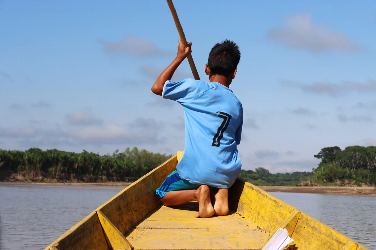 A boy sails on the Beni River. 