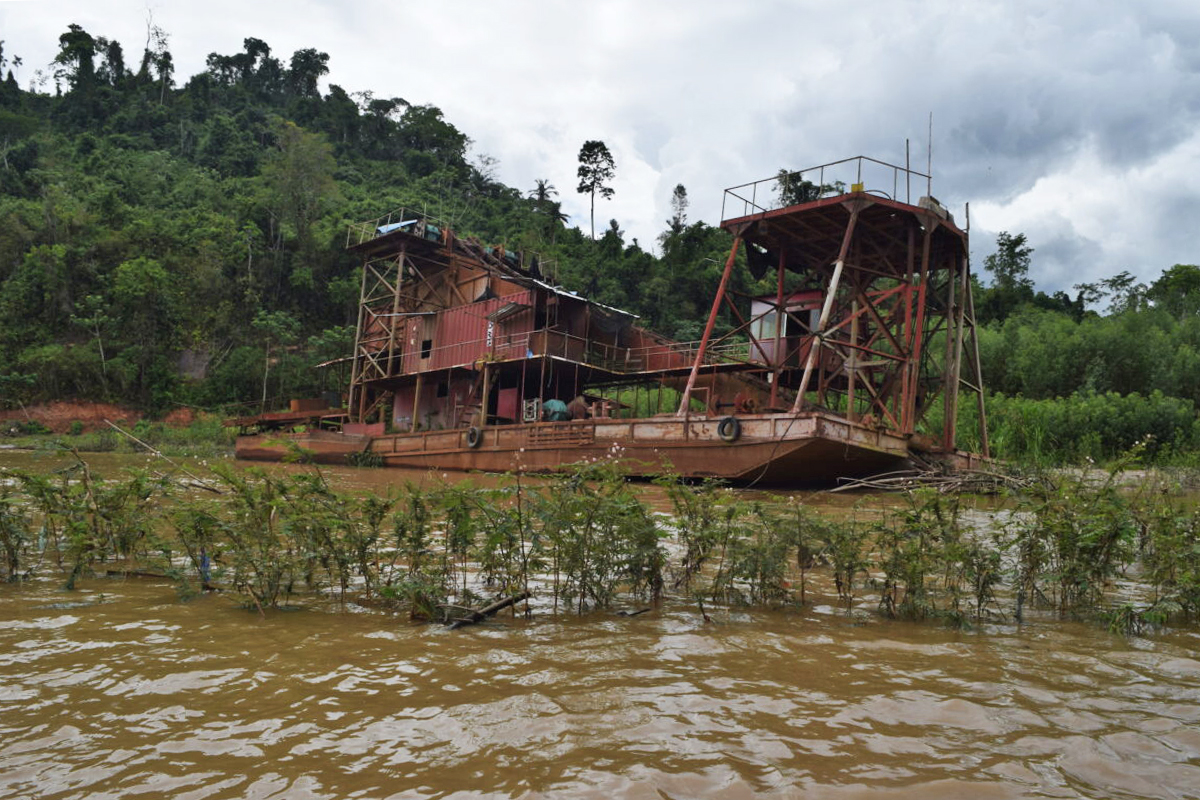 Some dredges near Madidi that have been abandoned following checks by local authorities. This dredge is in the Kaká River. 