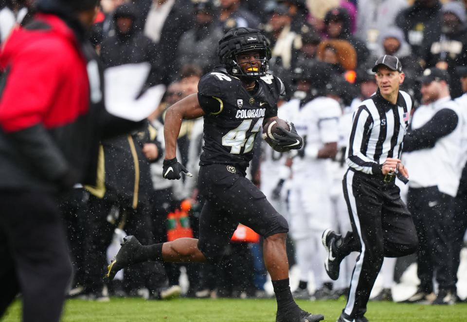 Apr 22, 2023; Boulder, CO, USA; Colorado Buffaloes linebacker Jeremiah Brown (42) returns a blocked field goal during the first half of the spring game at Folsom Filed. Mandatory Credit: Ron Chenoy-USA TODAY Sports