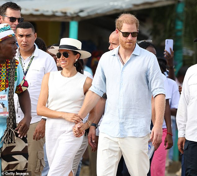 Meghan dressed in white linen skirt, sleeveless blouse and Panama hat, while Harry wore a blue linen shirt