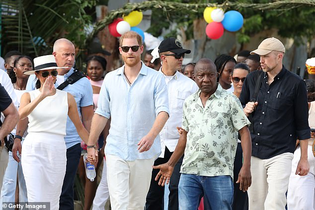 Meghan and Harry were accompanied by security as they walked through the streets