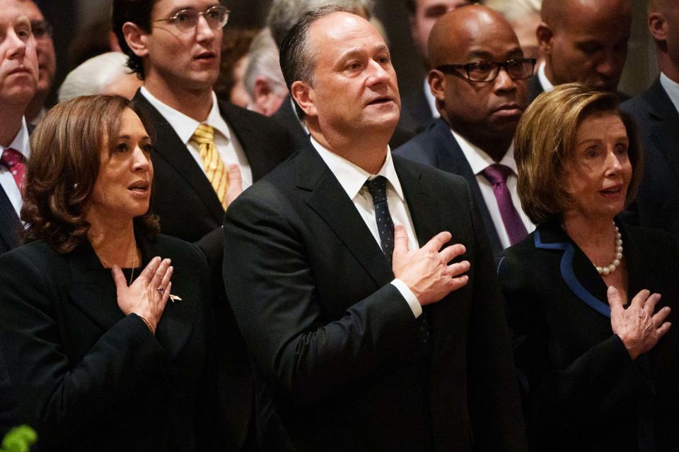 Vice President Kamala Harris, her husband Douglas Emhoff and House Speaker Nancy Pelosi sing the National Anthem during a memorial service for the late Queen Elizabeth II at Washington National Cathedral Wednesday, Sept. 21, 2022.