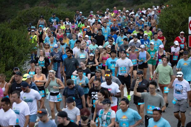 SAN DIEGO, CA - AUGUST 18, 2024: Half marathon runners run toward the start line at Cabrillo National Monument during the 47th annual America's Finest City Half Marathon and 5K in San Diego on Sunday, August 18, 2024. Over 1,300 people participated in the 5K and more than 4,300 in the half marathon. (Hayne Palmour IV / For The San Diego Union-Tribune)