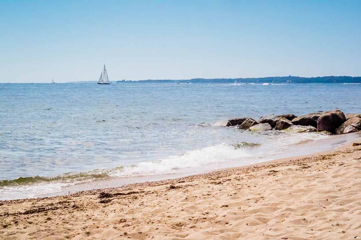 cape cod massachusetts beaches A beautiful ocean whitecap waves roll onto the sandy beach of the island