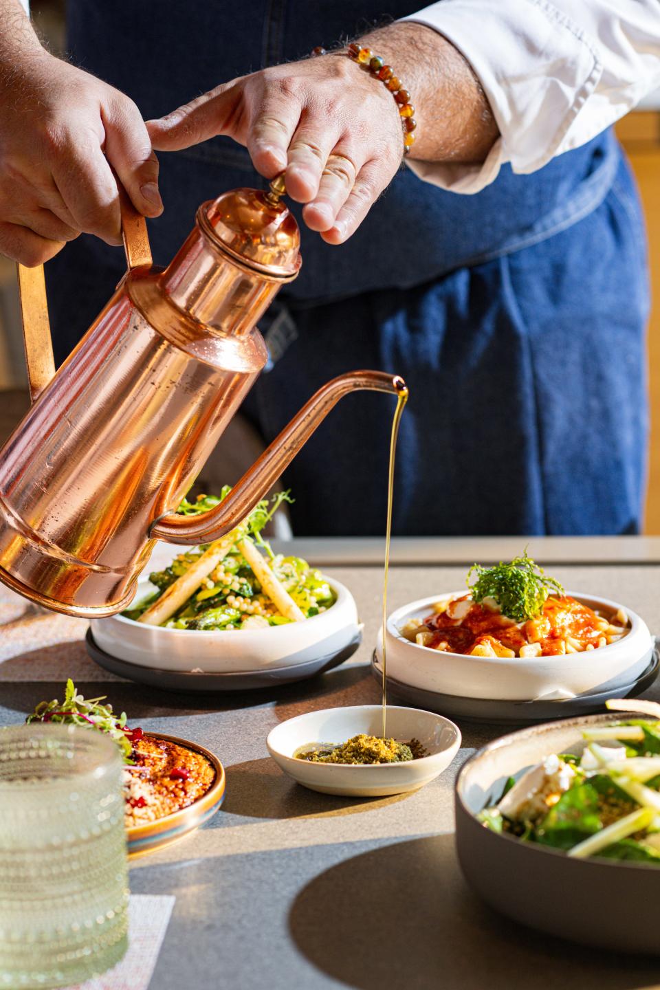 Sofra at The Ritz-Carlton, Naples pours a proprietary olive oil exclusive to the restaurant.