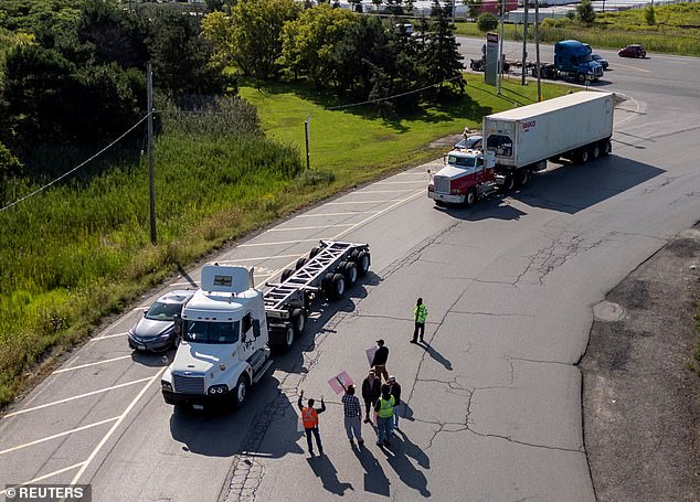 Locked out CPKC workers are seen stopping trucks for five minutes today before letting them enter the CPKC Vaughan yard, near Toronto