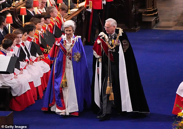 The Duke and Duchess of Gloucester make their way to their seats at the King's Coronation, May 2023