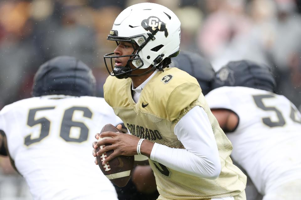 BOULDER, COLORADO - APRIL 27: Quarterback Walter Taylor III #9 of the Colorado Buffaloes rolls out of the pocket during their spring game at Folsom Field on April 27, 2024 in Boulder, Colorado. (Photo by Matthew Stockman/Getty Images)