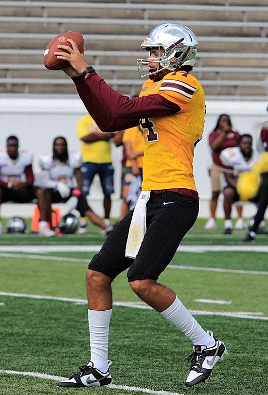 Bethune-Cookman QB Dominiq Ponder takes a snap during the Wildcats' spring game Saturday, April 22, 2023, at Daytona Stadium.

Bethune 10