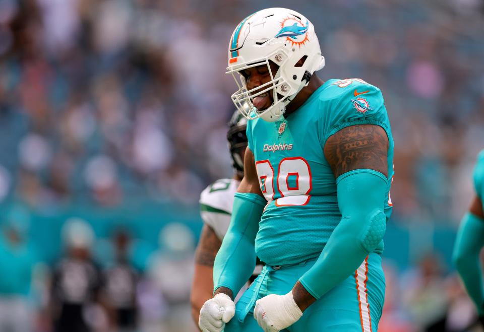 MIAMI GARDENS, FLORIDA - JANUARY 08: Raekwon Davis #98 of the Miami Dolphins reacts after a play during the second quarter against the New York Jets at Hard Rock Stadium on January 08, 2023 in Miami Gardens, Florida. (Photo by Megan Briggs/Getty Images)