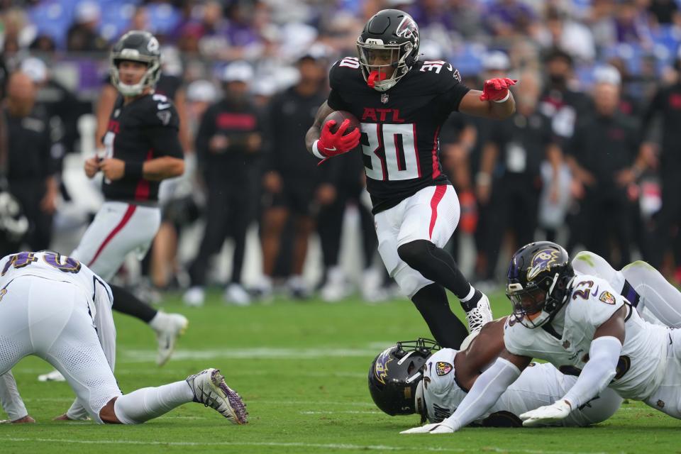 Aug 17, 2024; Baltimore, Maryland, USA; Atlanta Falcons running back Jase McClellan (30) gains yards against the Baltimore Ravens during the first quarter at M&T Bank Stadium. Mandatory Credit: Mitch Stringer-USA TODAY Sports