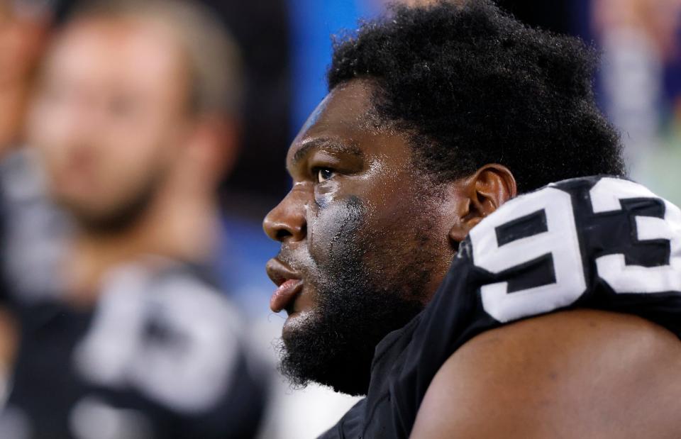 ARLINGTON, TX - AUGUST 26: Byron Young #93 of the Las Vegas Raiders looks on from the sidelines as the Raiders take on the Dallas Cowboys during the first half of a preseason game at AT&T Stadium on August 26, 2023 in Arlington, Texas. (Photo by Ron Jenkins/Getty Images)