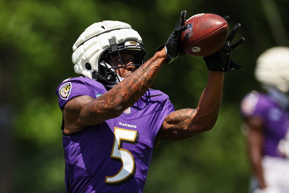 OWINGS MILLS, MD - AUGUST 12: Jalyn Armour-Davis #5 of the Baltimore Ravens catches a pass during training camp at Under Armour Performance Center Baltimore Ravens on August 12, 2024 in Owings Mills, Maryland. (Photo by Scott Taetsch/Getty Images)