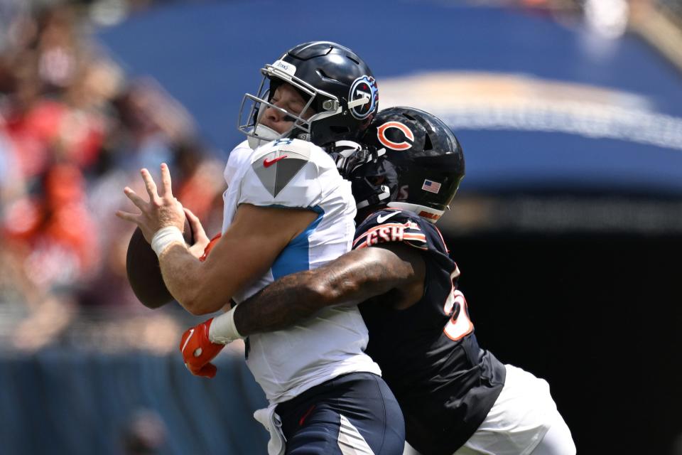 CHICAGO, ILLINOIS - AUGUST 12: Will Levis #8 of the Tennessee Titans is sacked in the second half by Terrell Lewis #52 of the Chicago Bears during a preseason game at Soldier Field on August 12, 2023 in Chicago, Illinois. (Photo by Quinn Harris/Getty Images)