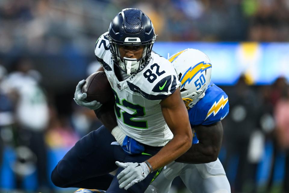 Aug 10, 2024; Inglewood, California, USA; Seattle Seahawks wide receiver Cody White (82) runs the ball against Los Angeles Chargers linebacker Shane Lee (50) during the fourth quarter at SoFi Stadium. Mandatory Credit: Jonathan Hui-USA TODAY Sports