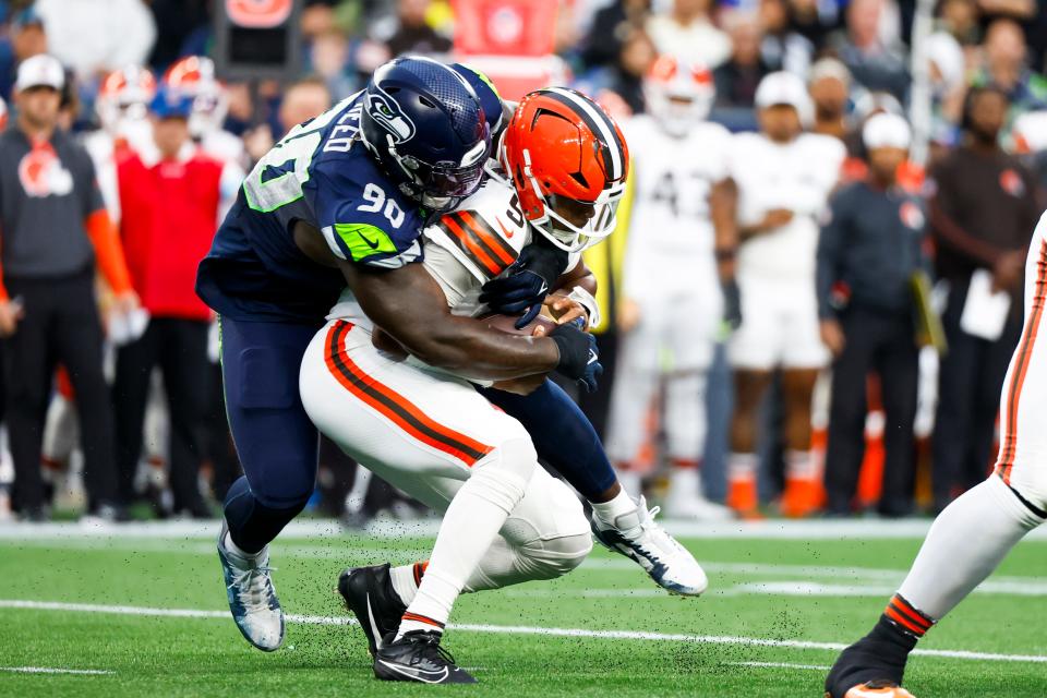 Aug 24, 2024; Seattle, Washington, USA; Seattle Seahawks defensive tackle Jarran Reed (90) sacks Cleveland Browns quarterback Jameis Winston (5) during the first quarter at Lumen Field. Mandatory Credit: Joe Nicholson-USA TODAY Sports