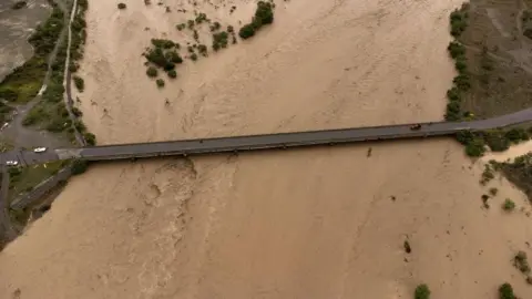 EPA Aerial photograph showing the Ocoa River bursting its banks due to heavy rains, in Palmar de Ocoa, Dominican Republic 18 November 2023.