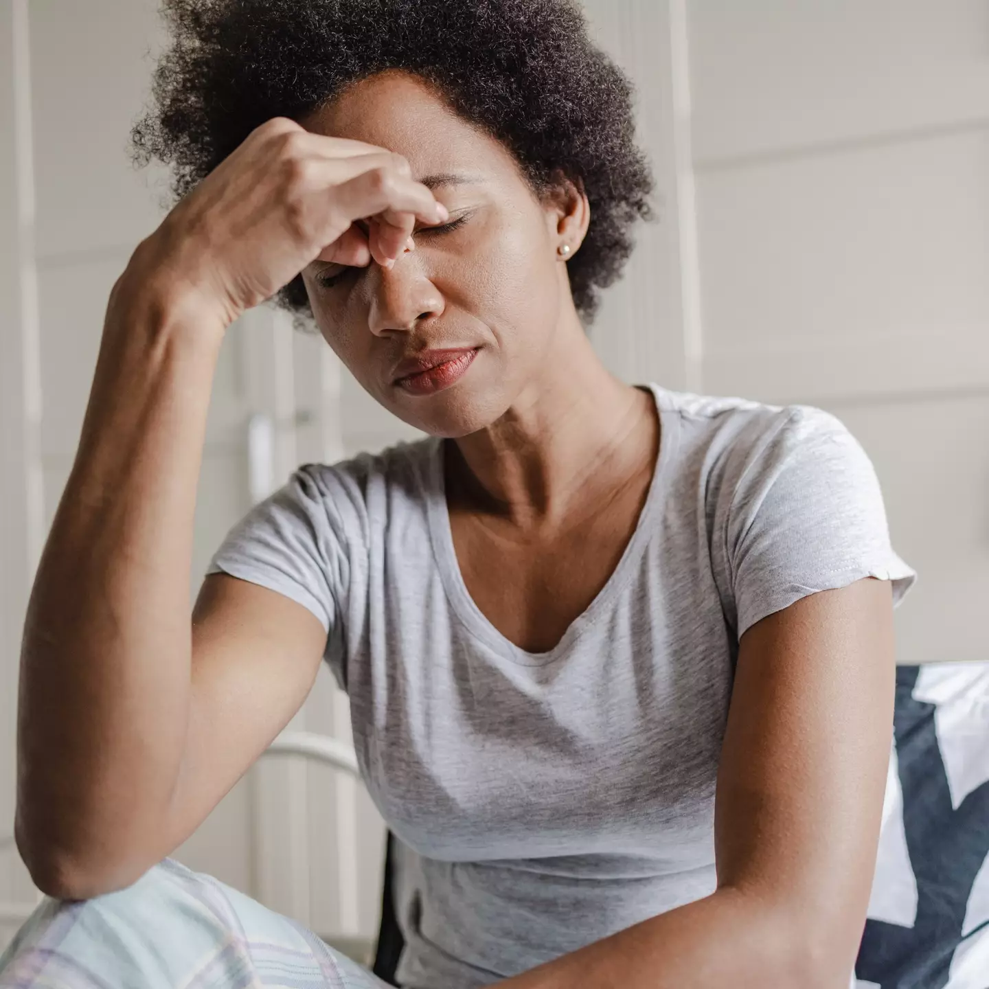 Headaches and vomiting are known symptoms of 'sloth fever' (Getty Stock Images) 