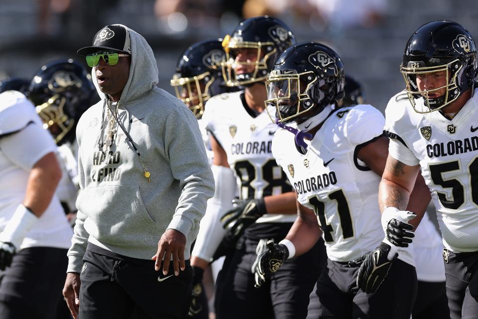 TEMPE, ARIZONA - OCTOBER 07: Head coach Deion Sanders of the Colorado Buffaloes leads teammates onto the field before the NCAAF game against the Arizona State Sun Devils at Mountain America Stadium on October 07, 2023 in Tempe, Arizona. (Photo by Christian Petersen/Getty Images)