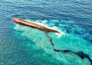 Gunmen storm mystery shipwreck that triggered massive oil spill