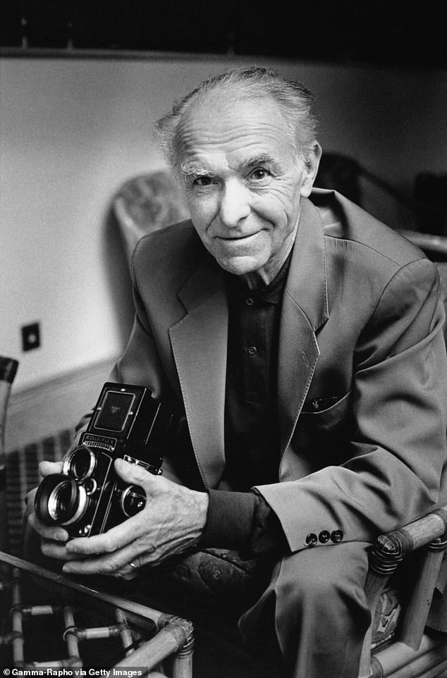 Photographer Robert Doisneau with a camera Rolleiflex during 1992 in France