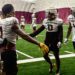 Arizona State defensive backs Cole Martin (#0) and Rodney Bimage Jr. (#17) greet teammates after br...