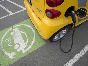 A electric car getting charged at a parking lot in Tsawwassen, near Vancouver, B.C.