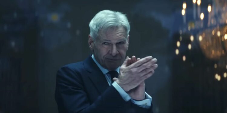 Harrison Ford claps while wearing a knowing expression in Captain America: Brave New World.