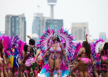 Costumed dancers and mas bands add sizzle to a sweltering day at the Toronto Caribbean Carnival Grand Parade