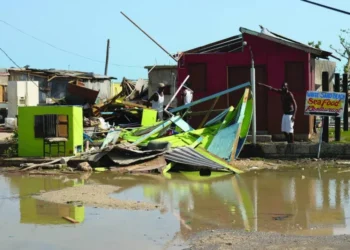 A man gestures next to a destroyed house after the passing of Hurricane Beryl, in Clarendon, Jamaica, recently. (Reuters)