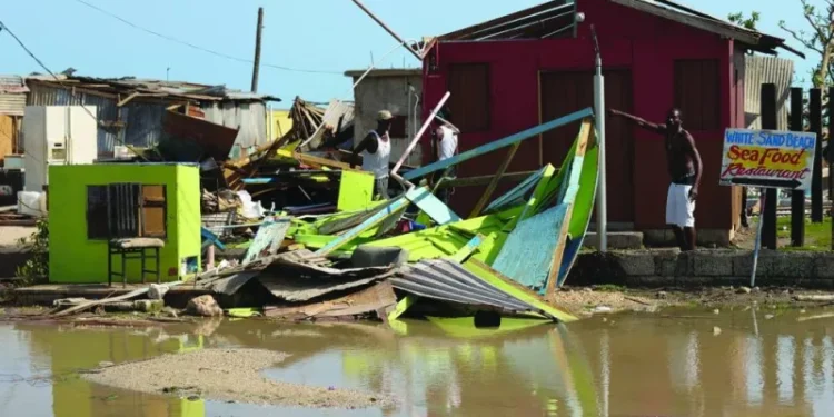 A man gestures next to a destroyed house after the passing of Hurricane Beryl, in Clarendon, Jamaica, recently. (Reuters)