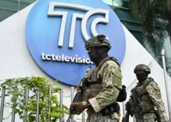 Getty Images Soldiers patrol outside the broadcast channel targeted by gangs earlier this week