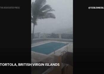 Ernesto strengthens into a hurricane after pounding Caribbean islands with heavy rain and storm winds