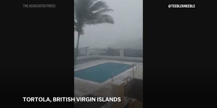 Ernesto strengthens into a hurricane after pounding Caribbean islands with heavy rain and storm winds